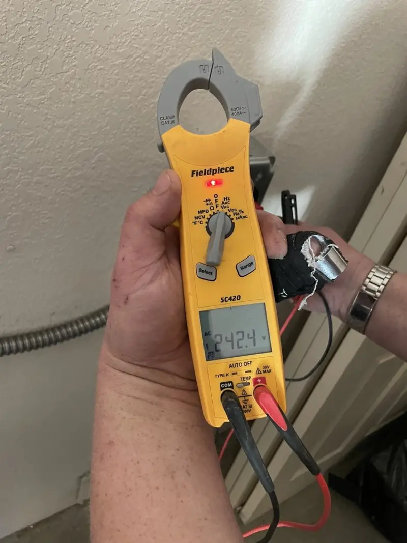 Voltage testing with clamp meter during Outlet Installation in Ladson